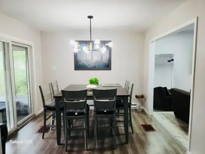 a dining room with a table and chairs at Poconos Retreat in Bushkill
