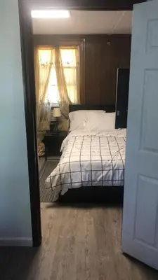 a bedroom with a bed and a window at room with a private shower in Arlington