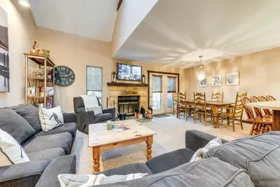 a living room with couches and a table at Community Beach Access Lake Harmony Townhome in Lake Harmony