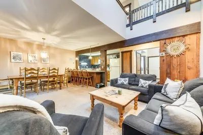 a living room with couches and a table at Community Beach Access Lake Harmony Townhome in Lake Harmony