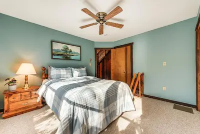 a bedroom with a bed and a ceiling fan at Community Beach Access Lake Harmony Townhome in Lake Harmony