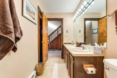 a bathroom with a sink and a mirror at Community Beach Access Lake Harmony Townhome in Lake Harmony