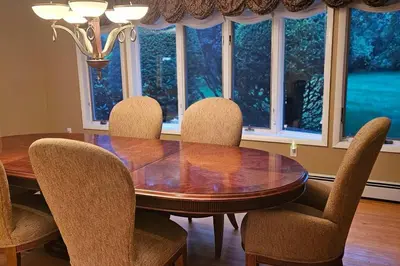 a dining room with a wooden table and chairs at Escape to the Catskills in Liberty