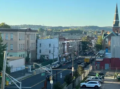 a view of a city with cars parked on a street at The Comfy Suite - 1BR with Free Parking in Paterson