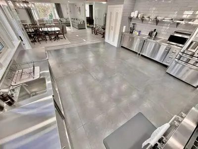an aerial view of a kitchen and dining room at Ultimate Luxury Villa - Pool, Sauna, Hot Tub & More in Paterson
