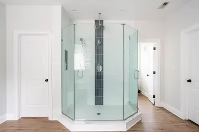 a glass shower in a room with two doors at Pike Creek Palace 6 Bedrooms with 5 King beds Villa in Wilmington's Chateau Country in Wilmington