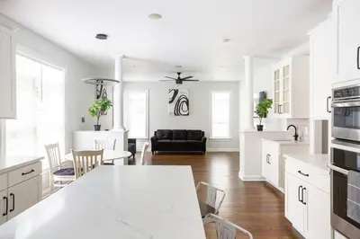 a kitchen and living room with a table and chairs at Pike Creek Palace 6 Bedrooms with 5 King beds Villa in Wilmington's Chateau Country in Wilmington