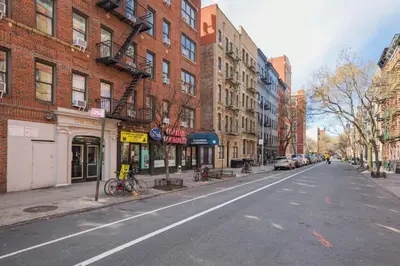 an empty street in a city with buildings at Blueground Chelsea elev wd nr 8th Ave NYC-1450 in New York