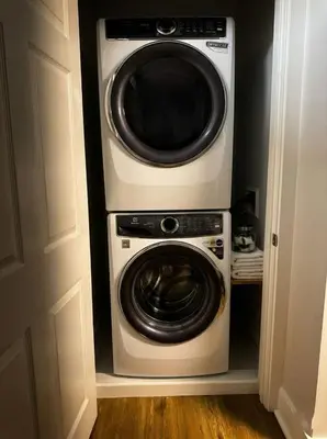 a washer and dryer in a small room at Cozy unit King bed & laundry in Wilmington