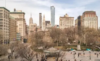 a view of a city with people in a park at Heart of Downtown Manhattan - Stylish One Bedroom Apartment in Vibrant Union Square in New York