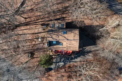 an overhead view of a house in the woods at Gorgeous 5BD w Hot-Tub & Pool villa located in the middle of Pocono in East Stroudsburg