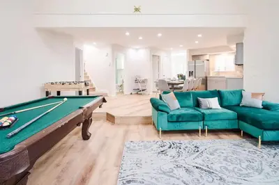 a living room with a pool table and couch at Wonderful Family Place w/HotTub/Sauna/Billiard/Private Pool in East Stroudsburg