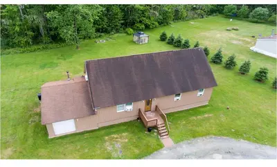 an overhead view of a house with a large roof at Cozy Palace in Livingston Manor