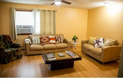 a living room with two couches and a coffee table at Cozy Palace in Livingston Manor