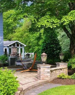 a bench on a patio in front of a house at 37 Oak Ridge House in Wellsboro