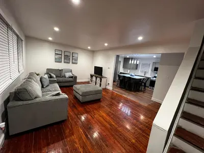 a living room with a couch and a table at Spacious 3 BR Ewing Home -Quiet in Trenton