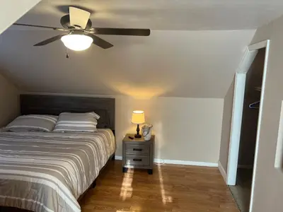 a bedroom with a bed and a ceiling fan at Spacious 3 BR Ewing Home -Quiet in Trenton