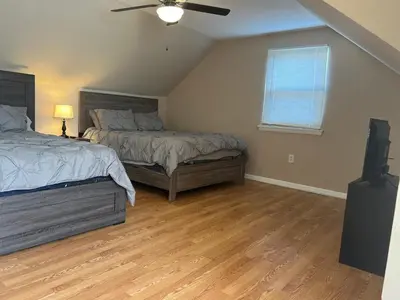 a bedroom with two beds and a ceiling fan at Spacious 3 BR Ewing Home -Quiet in Trenton