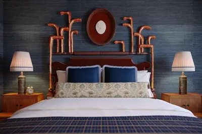 a bedroom with a large bed with two lamps at Graduate by Hilton Princeton in Princeton