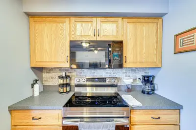 a kitchen with a stove and a microwave at Lake Harmony Condo with Big Boulder Lake Views in Lake Harmony