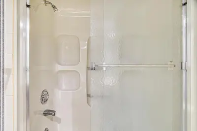 a white shower with a glass door in a bathroom at Lake Harmony Condo with Big Boulder Lake Views in Lake Harmony