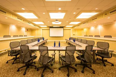 a conference room with a long table and chairs at Hotel Du Pont in Wilmington