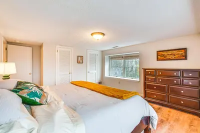 a bedroom with a large bed and a dresser at 7 Mi to Newark Montclair Vacation Rental in Montclair
