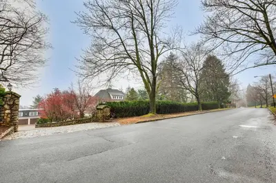 an empty street with trees on the side of the road at 7 Mi to Newark Montclair Vacation Rental in Montclair