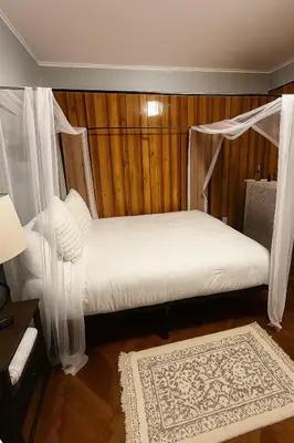 a bedroom with a bed with a canopy at Spacious 4BR near NYC with Parking, 10min MetLife, 20min Times Sq in North Bergen