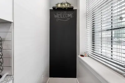 a black wall in a bathroom with a window at Luxury Urban 1BR King Bed-Parking - Heart of Historic Germantown - Temple & LaSalle -105- Stay Long Term! in Philadelphia