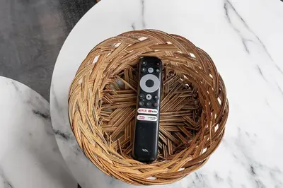 a remote control sitting in a basket on a table at Luxury Urban 1BR King Bed-Parking - Heart of Historic Germantown - Temple & LaSalle -105- Stay Long Term! in Philadelphia
