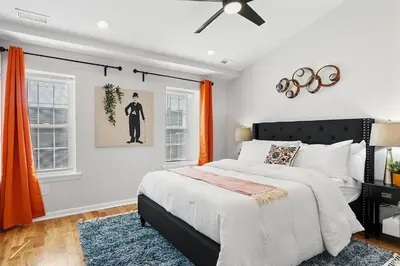 a bedroom with a bed and a ceiling fan at Fitler Square GEM - 3 Bedrooms in Philadelphia
