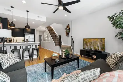 a living room with a couch and a table at Fitler Square GEM - 3 Bedrooms in Philadelphia