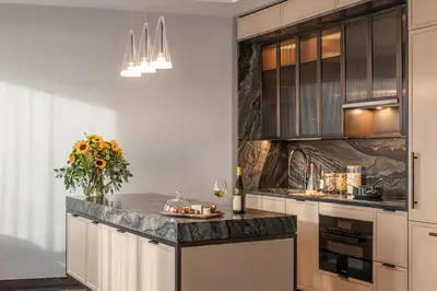 a kitchen with a counter with a vase of flowers at Maison Hudson in New York