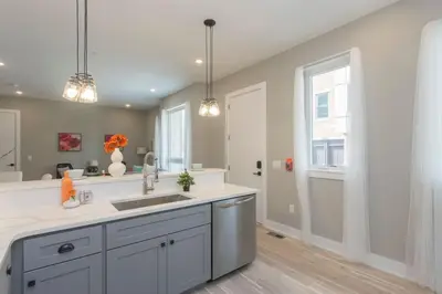 a kitchen with a sink and a counter at PRISTINE 3 bdrm - Garage Parking - Close to UPENN in Philadelphia