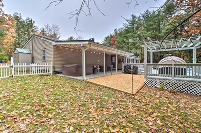 a backyard with a house and a fence at Oasis Hot Tub Pool Game Room in Saylorsburg