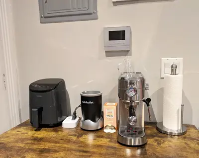 a kitchen counter with a blender and a coffee maker at Lovely Room at 3 bedroom Apt at the heart of East Village in New York