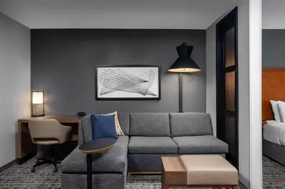 a living room with a couch and a desk at Hyatt Place Mt. Laurel in Mount Laurel