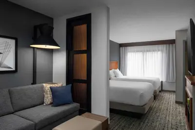 a hotel room with a bed and a couch at Hyatt Place Mt. Laurel in Mount Laurel