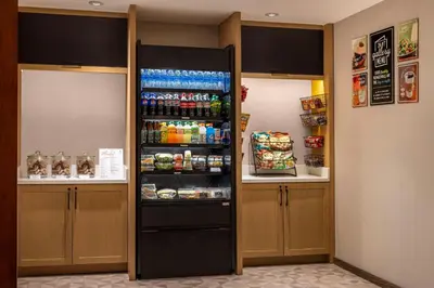 a refrigerator in a room with food and drinks at Hyatt Place Mt. Laurel in Mount Laurel