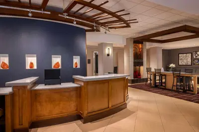 a lobby with a reception desk and a bar at Hyatt Place Mt. Laurel in Mount Laurel