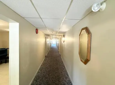 a long hallway with a mirror on the wall at Kiteville Lancaster in Strasburg
