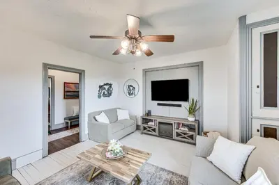 a living room with a couch and a ceiling fan at Pet and Family Friendly! Home with Fenced Yard and Deck in York Haven