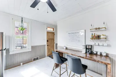 a kitchen with two chairs sitting at a counter at Pet and Family Friendly! Home with Fenced Yard and Deck in York Haven