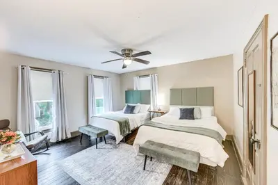 a bedroom with two beds and a ceiling fan at Pet and Family Friendly! Home with Fenced Yard and Deck in York Haven