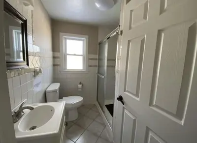 a bathroom with a sink and a toilet and a shower at Hideaway - LakeHouse/spa/dock/ in Pocono Summit