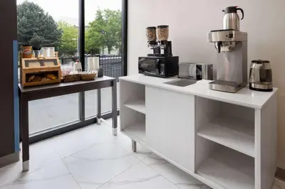 a kitchen with a counter with a coffee maker at Days Inn by Wyndham Staten Island in Staten Island