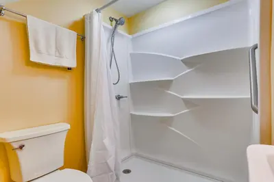 a bathroom with a shower and a toilet at Historic Farmhouse in Layton with Deck! in Layton