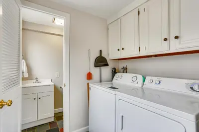 a white laundry room with a washer and dryer at Historic Farmhouse in Layton with Deck! in Layton