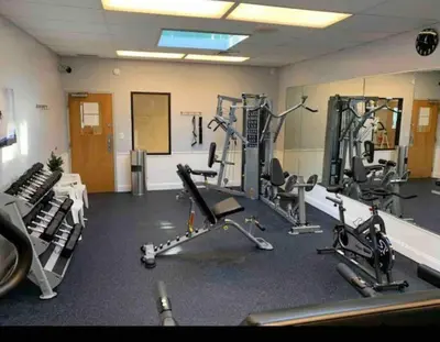 a gym with several treadmills and exercise bikes at Stylish Townhouse Steps to Ski Mtn & Waterpark in Tannersville